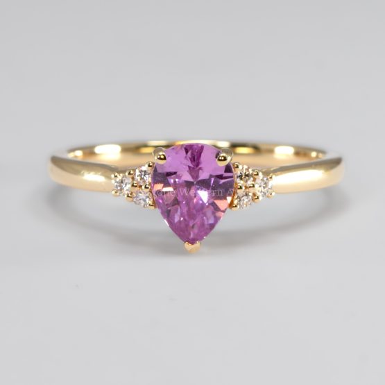 front view of Unheated Pear Cut Pink Sapphire Ring with Diamond Cluster in 18K Yellow Gold