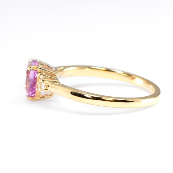 side view of Unheated Pear Cut Pink Sapphire Ring with Diamond Cluster in 18K Yellow Gold