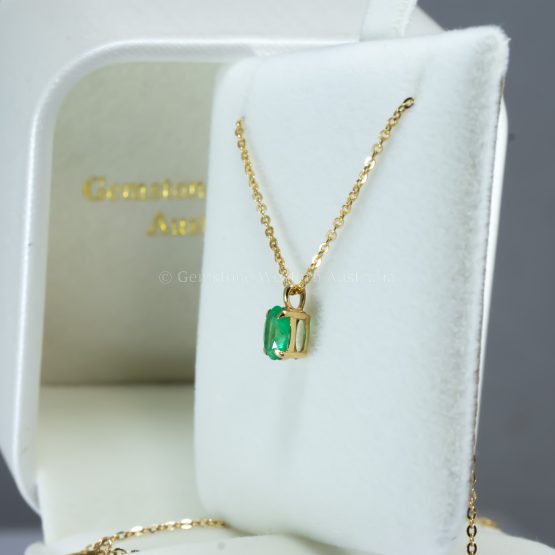 side view of 0.56ct Oval Colombian Emerald Pendant in 18K Yellow Gold
