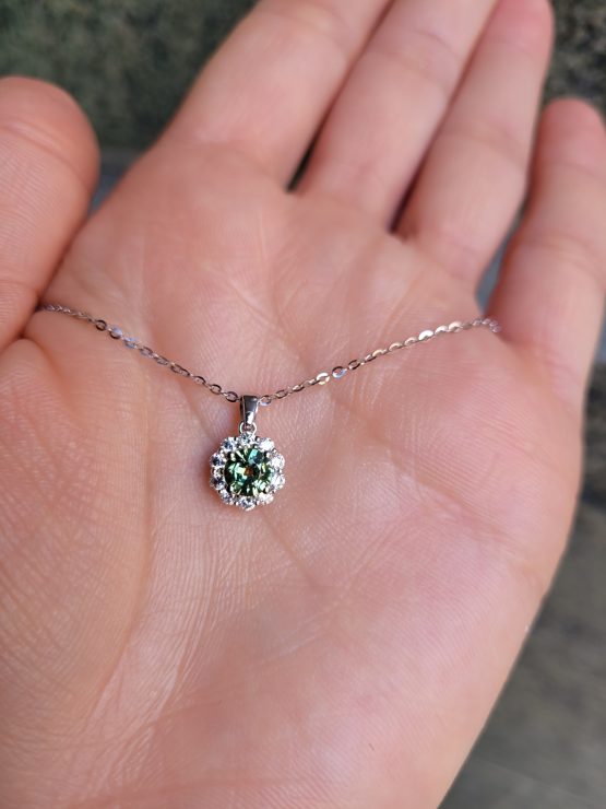 photo on hand of Australian Green Sapphire Halo Pendant in White Gold – 0.66ct - 1982834