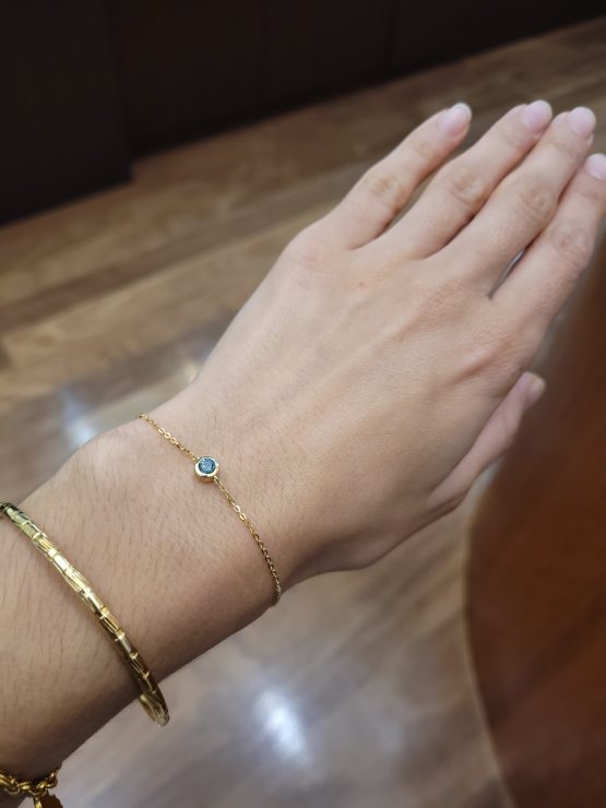 view on hand of Australian Teal Sapphire Bracelet in 18K Yellow Gold - 1982840