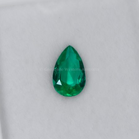 FRONT VIEW OF 0.60 CT NATURAL COLOMBIAN EMERALD - PEAR CUT