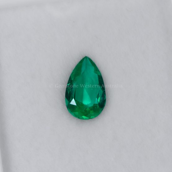 FRONT VIEW OF 0.60 CT NATURAL COLOMBIAN EMERALD - PEAR CUT