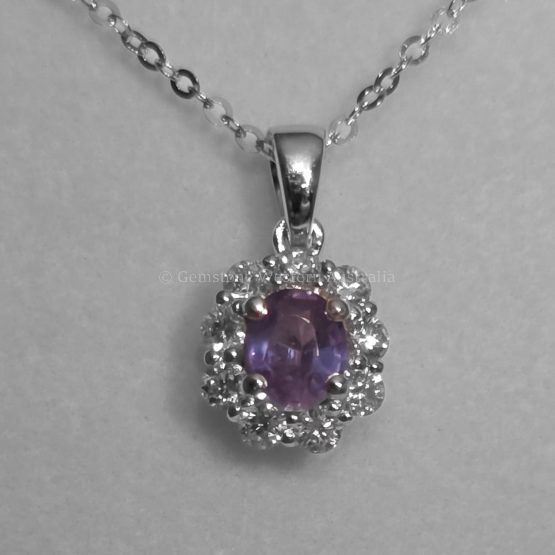 photo in incandescent light of Oval Alexandrite Pendant with Diamond Halo in Platinum - 1982845
