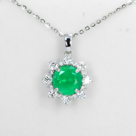 front view of Round Colombian Emerald Pendant with Diamond Halo in Platinum 950