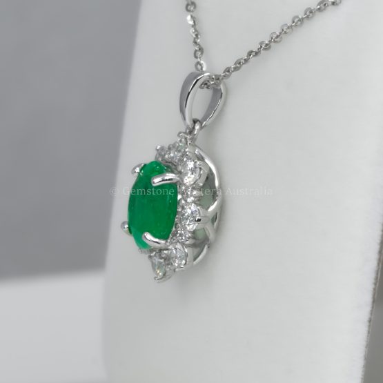 side view of Round Colombian Emerald Pendant with Diamond Halo in Platinum 950