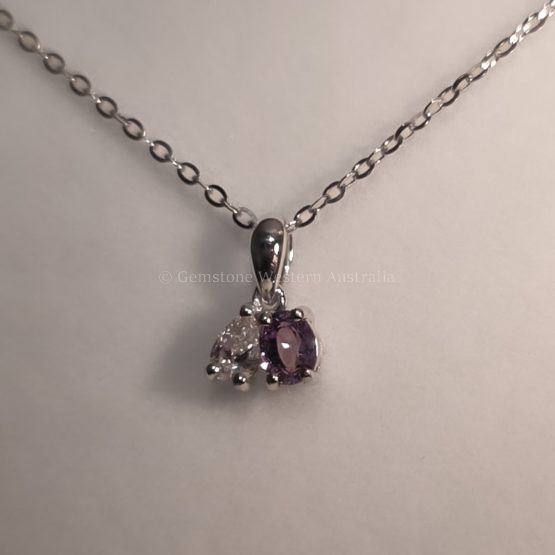 front view in incandescent light of Toi et Moi Platinum Pendant with Alexandrite and Pear Diamond - 1982844
