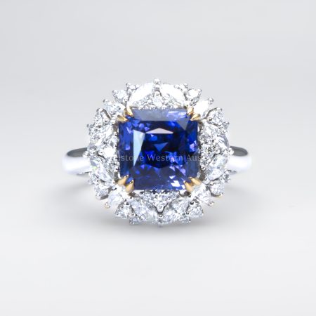 front view of 5.14ct Natural Blue Sapphire and Diamond Halo Dress Ring in Platinum and 18K Yellow Gold