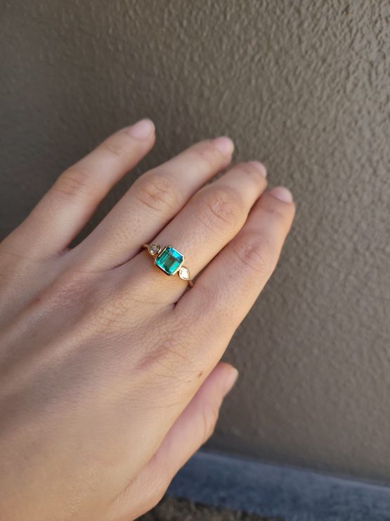 view on hand of Colombian Emerald Engagement Ring in 18K Yellow Gold with Pear Shape Diamonds - 1982871