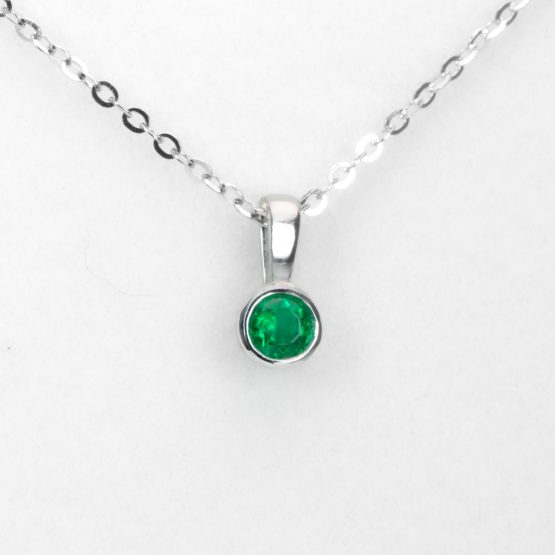 front view of Round Emerald Solitaire Pendant in Platinum with Vivid Green 0.18ct Stone - 1982874